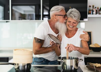 Happy,Senior,Couple,Having,Fun,Cooking,Together,At,Home,-